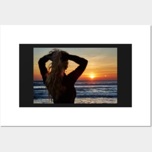 Beautiful woman on the beach at sunrise Posters and Art